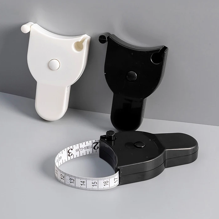 Black and white measuring devices on a gray surface with a gray background