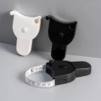 Black and white measuring devices on a gray surface with a gray background